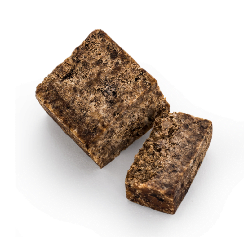 This is the image of a product named african black shop listed on the page of Wholesale - Lyons Choice Woocommerce store. the product features a white background an dthe two pieces of brown blackish african soaps in the centre.